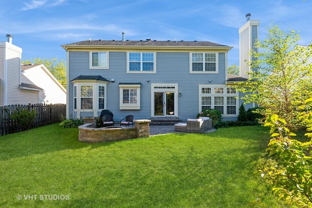 back of property featuring a patio and a lawn