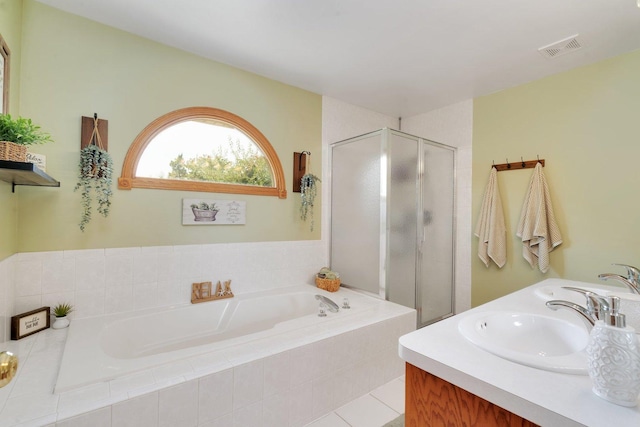 bathroom with separate shower and tub, tile patterned floors, and vanity