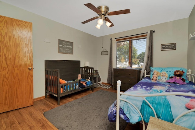 bedroom featuring ceiling fan and wood-type flooring