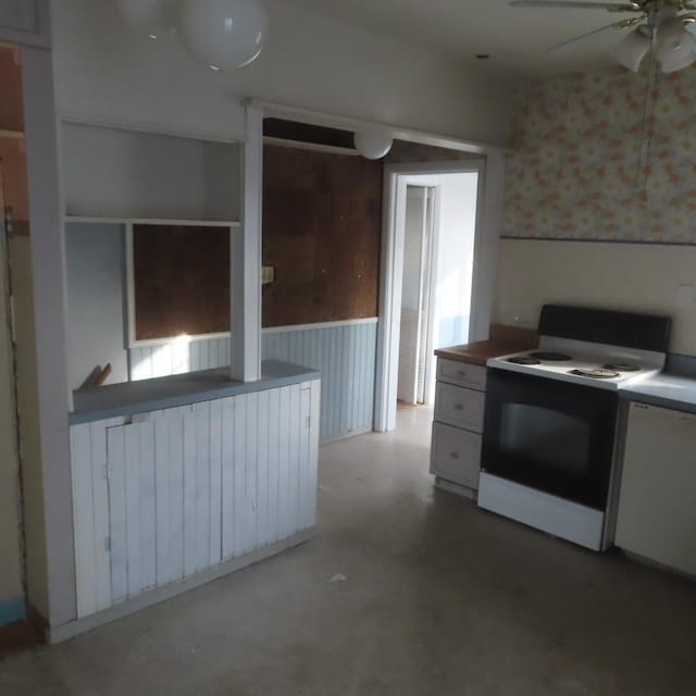 kitchen with white appliances, white cabinetry, and ceiling fan