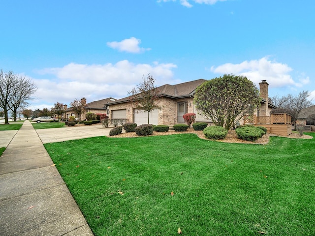 view of front of house featuring a garage and a front yard