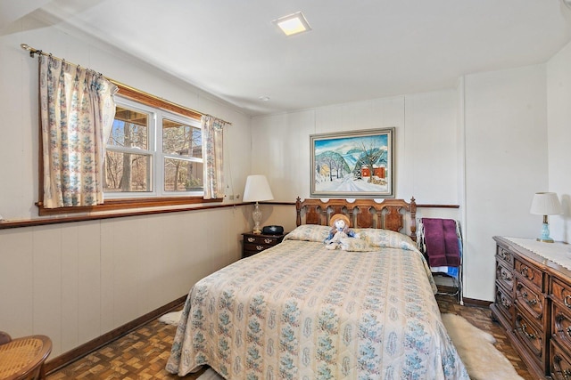 bedroom with dark parquet floors