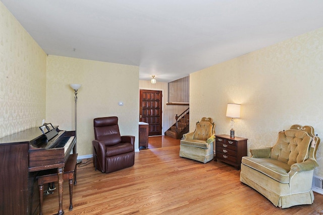 sitting room featuring light hardwood / wood-style floors