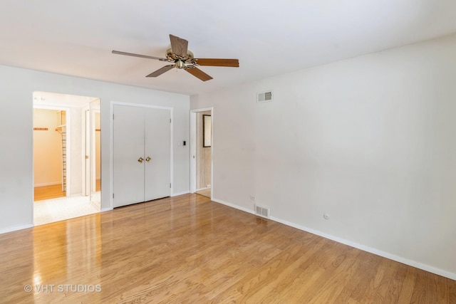 unfurnished room featuring ceiling fan and light hardwood / wood-style floors