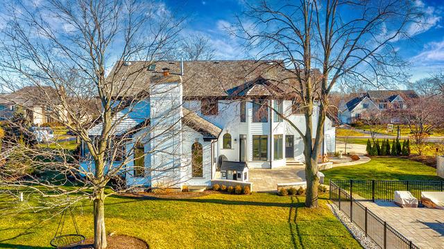 rear view of property with a yard and a patio