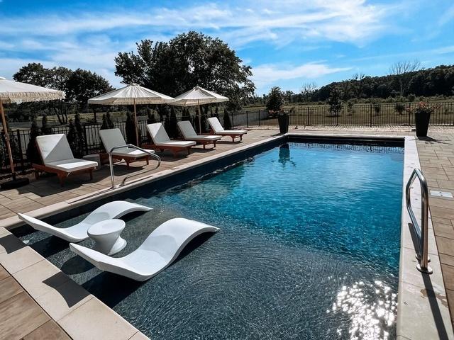 view of swimming pool with a patio area