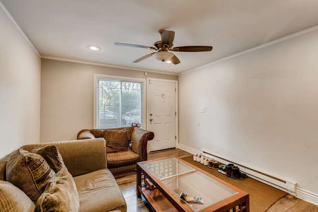 living room with light hardwood / wood-style flooring, ceiling fan, and ornamental molding