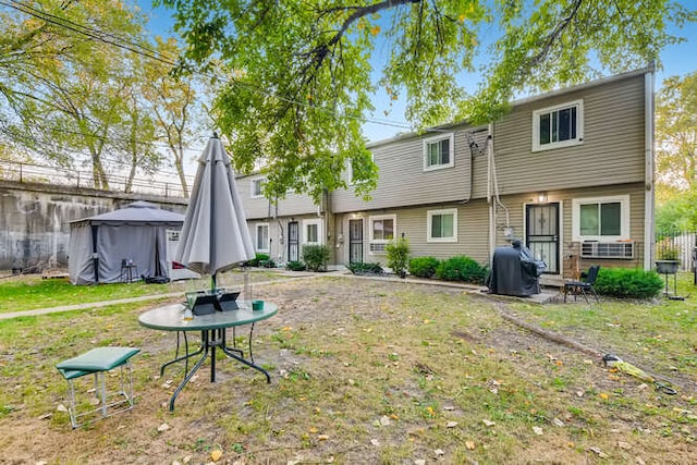 rear view of house with a lawn