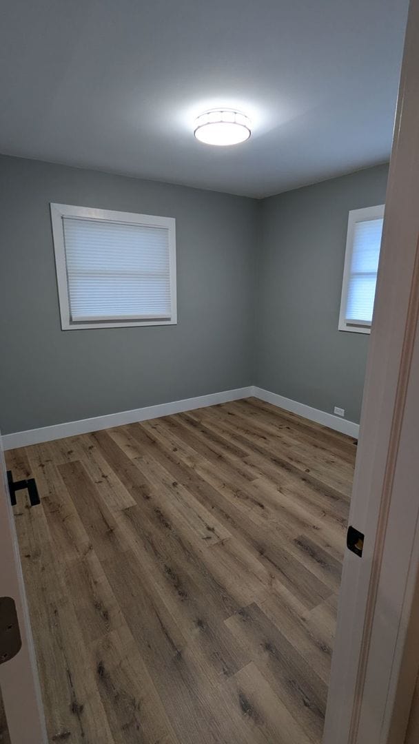 spare room featuring light wood-type flooring