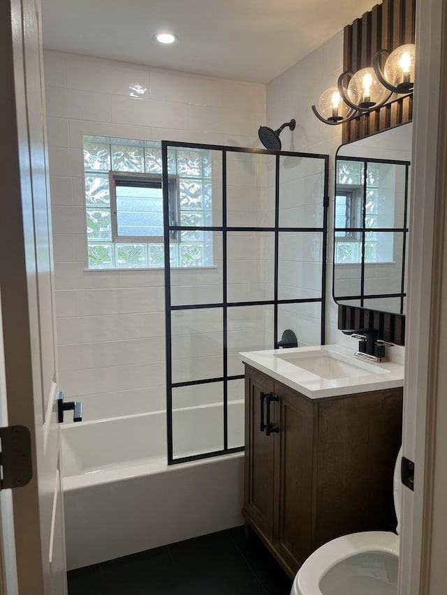 full bathroom with vanity, combined bath / shower with glass door, and toilet