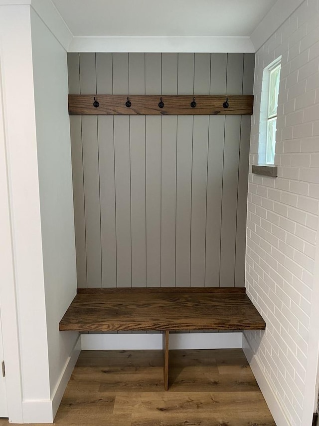 mudroom featuring light hardwood / wood-style floors and ornamental molding