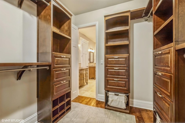 walk in closet featuring light wood-type flooring