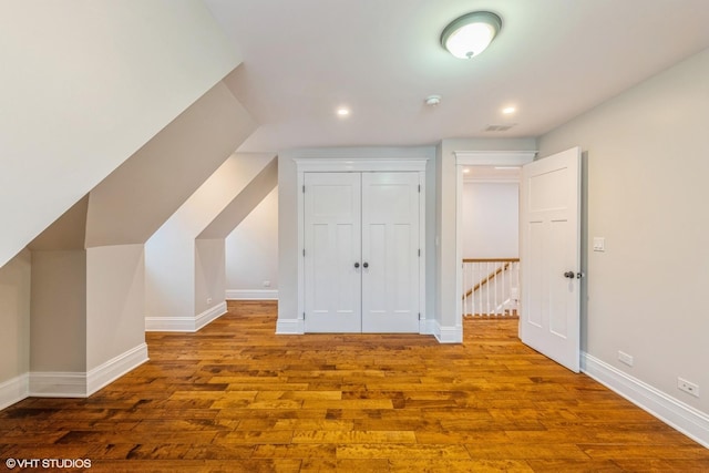 bonus room with hardwood / wood-style flooring