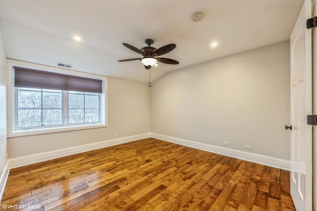 unfurnished room featuring ceiling fan, lofted ceiling, and hardwood / wood-style flooring