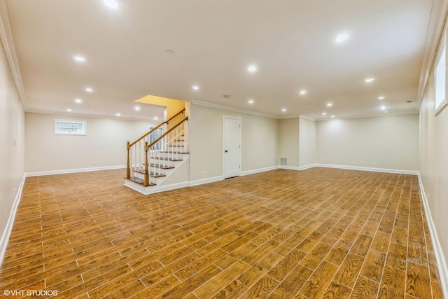 basement with wood-type flooring and ornamental molding