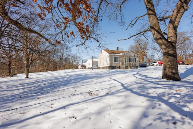 view of yard covered in snow