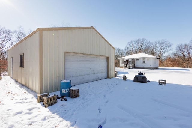 view of snow covered garage