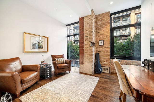 sitting room with dark wood-type flooring