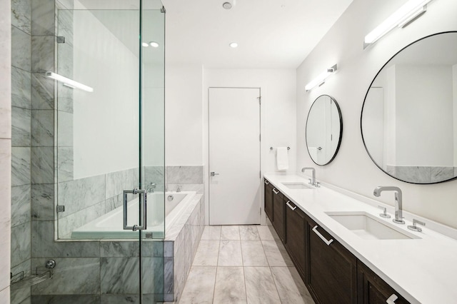 bathroom featuring plus walk in shower and vanity