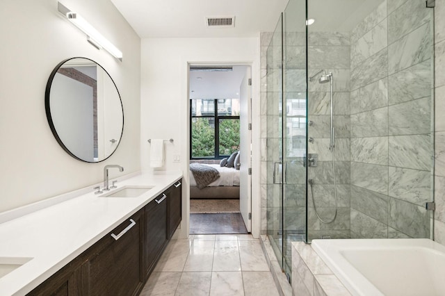 bathroom featuring plus walk in shower and vanity