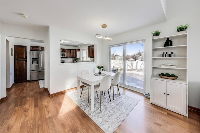 dining room with light hardwood / wood-style floors