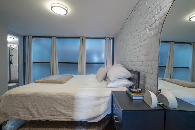 bedroom with brick wall