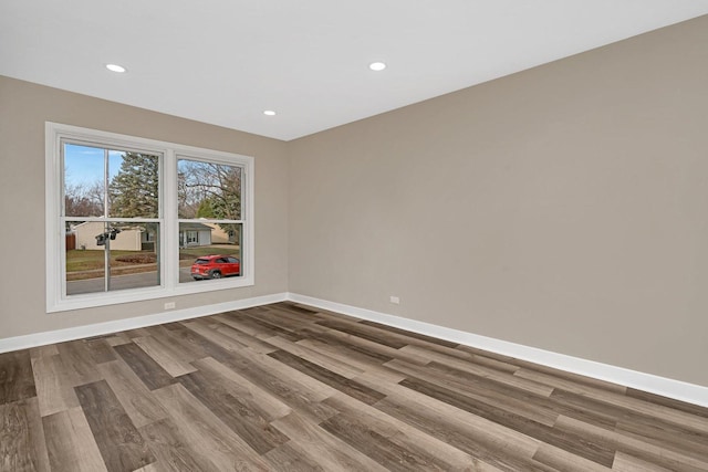 spare room featuring hardwood / wood-style flooring