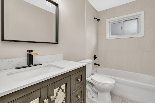 full bathroom with toilet, vanity, and tiled shower / bath