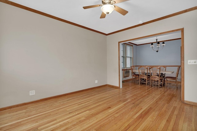 unfurnished room with ornamental molding, ceiling fan with notable chandelier, and light wood-type flooring