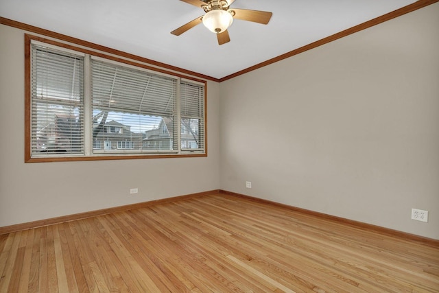 empty room featuring ceiling fan, light hardwood / wood-style floors, and ornamental molding