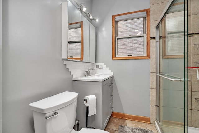 bathroom featuring backsplash, vanity, a shower with door, toilet, and lofted ceiling