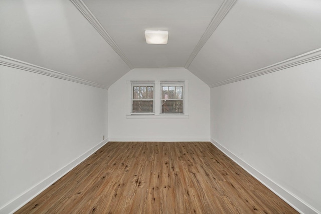 bonus room featuring light hardwood / wood-style flooring and vaulted ceiling