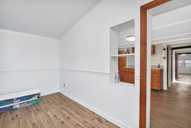 spare room with hardwood / wood-style flooring