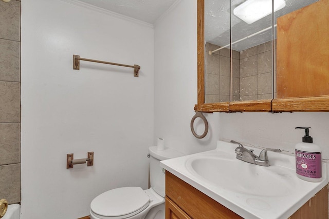 bathroom with vanity, ornamental molding, a textured ceiling, and toilet