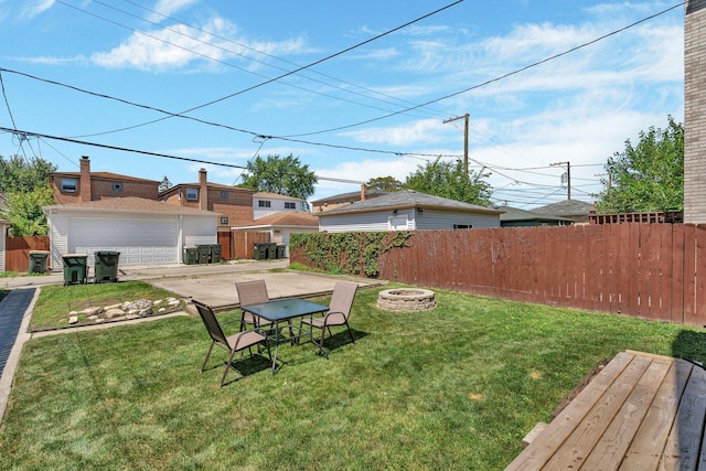 view of yard featuring an outdoor fire pit and a patio