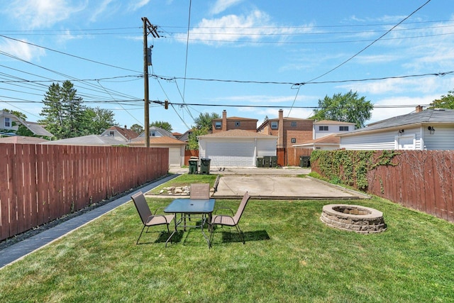 view of yard with a fire pit