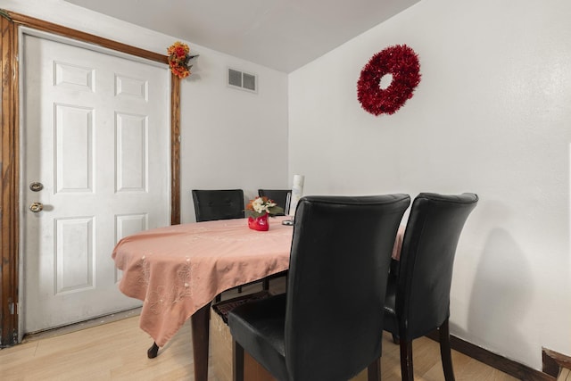 dining area featuring light wood-type flooring