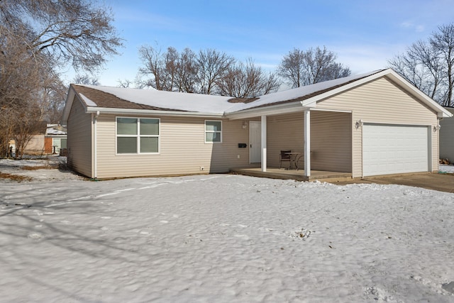 view of front facade featuring a garage and covered porch