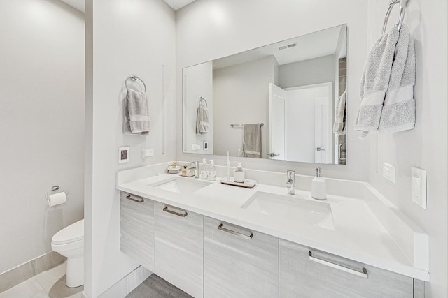 bathroom with vanity and toilet