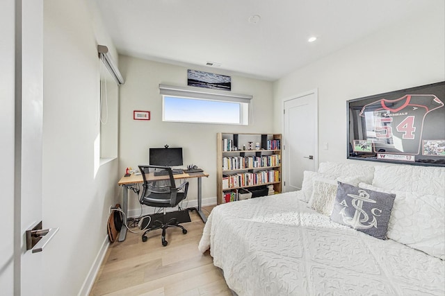 bedroom with light wood-type flooring