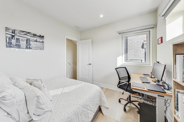 bedroom featuring light wood-type flooring