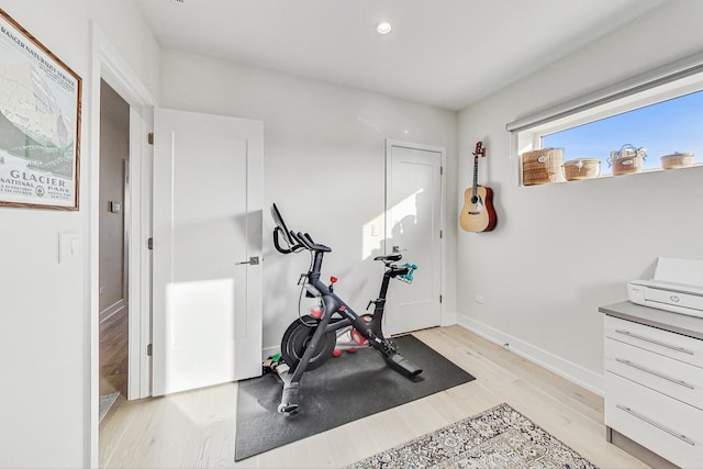 exercise area featuring light hardwood / wood-style floors