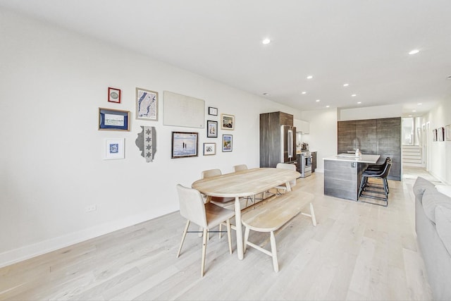 dining area featuring light wood-type flooring