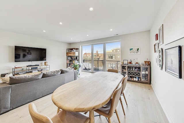 dining area with light wood-type flooring