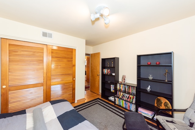 bedroom featuring a closet and light hardwood / wood-style flooring