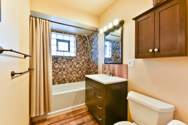 full bathroom featuring shower / tub combo, vanity, toilet, and wood-type flooring