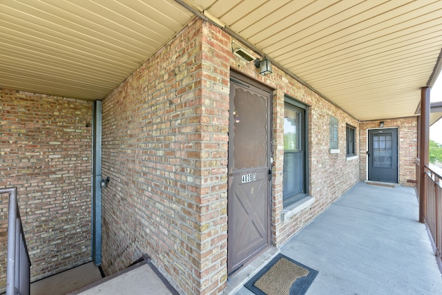 entrance to property featuring a porch