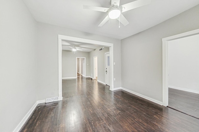 spare room with dark hardwood / wood-style floors and ceiling fan