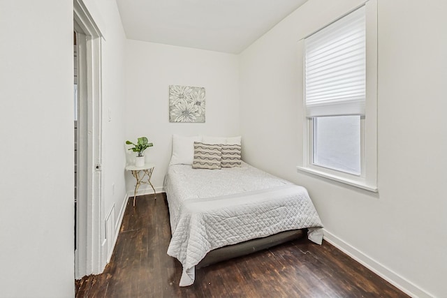 bedroom featuring dark hardwood / wood-style floors