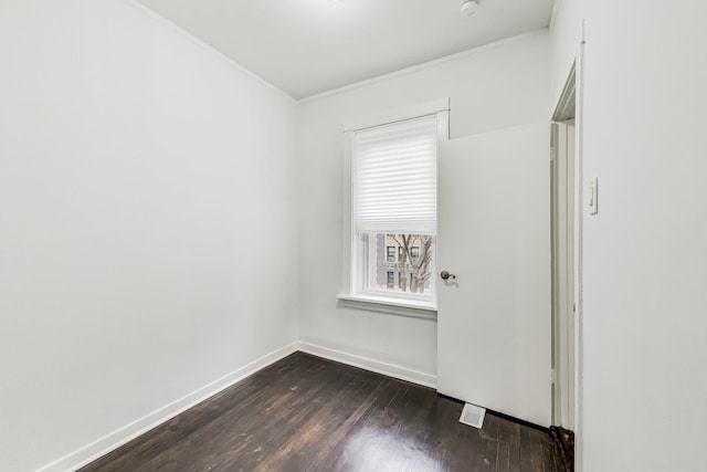 empty room featuring dark hardwood / wood-style flooring